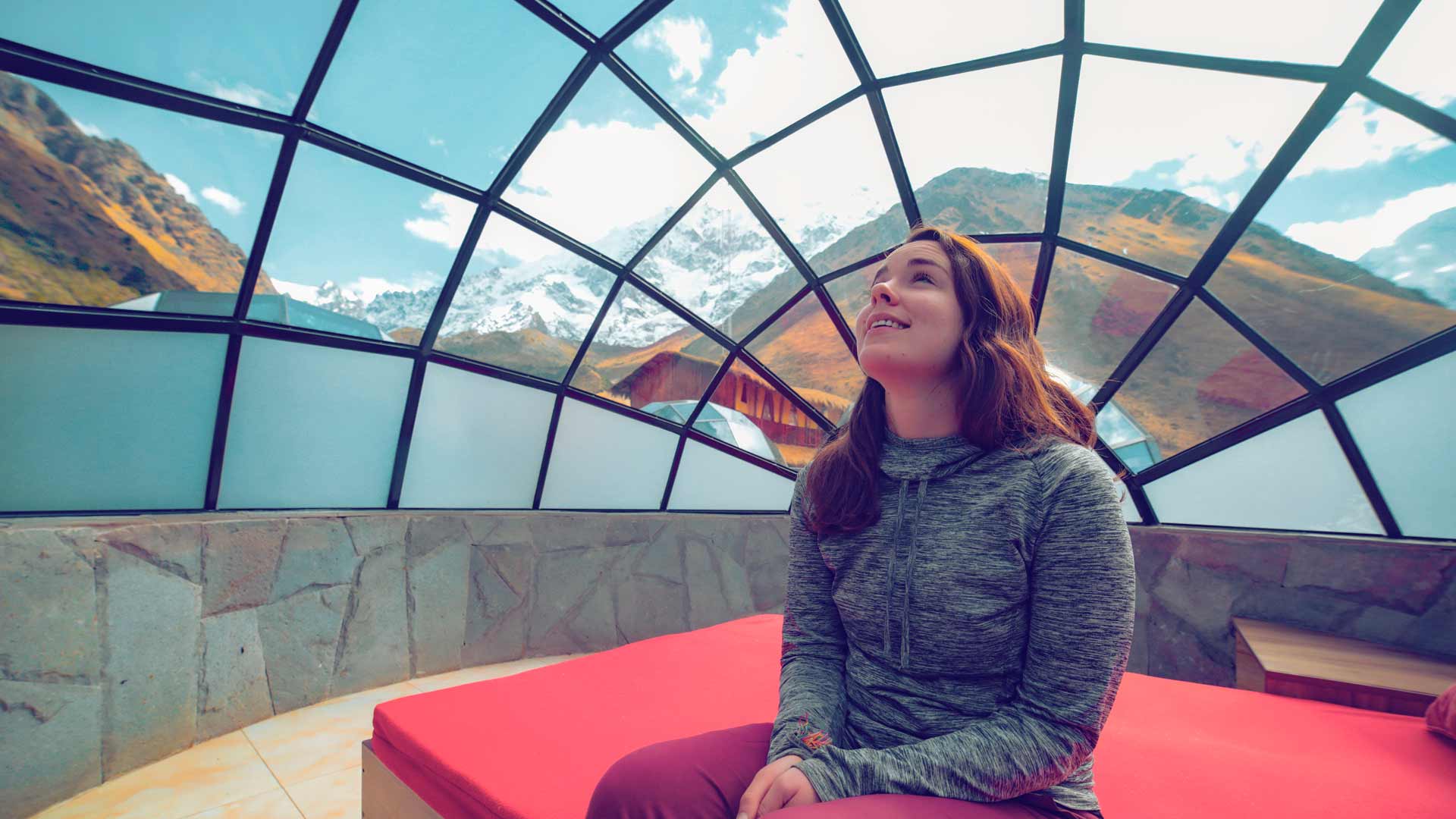 Tourist inside an igloo in the private SKY CAMP