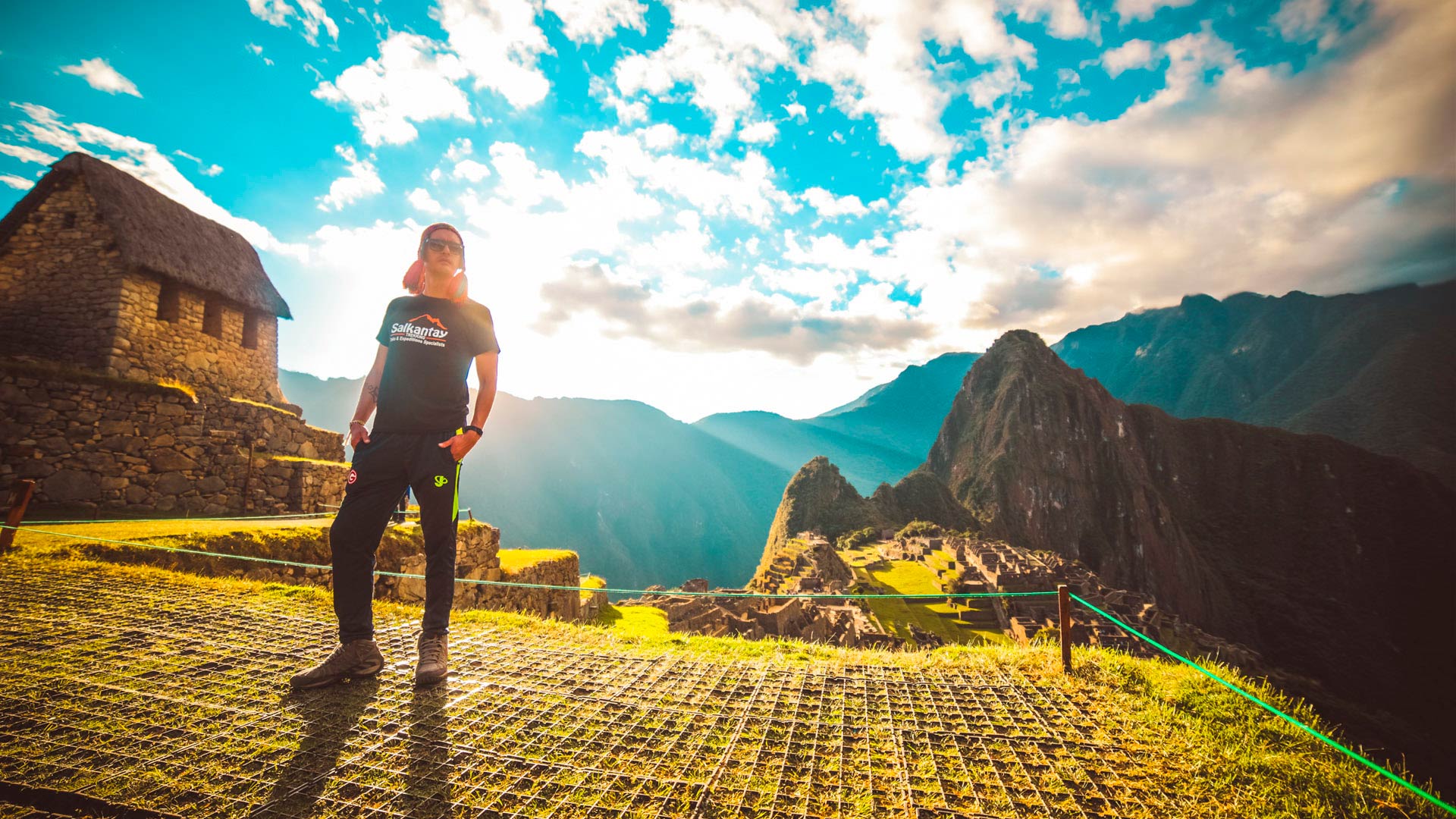 Panoramic view of Machu Picchu with a passenger from the Cusco Expeditions company