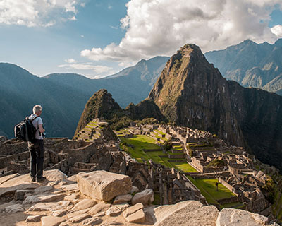 Man enjoying the panoramic view of Machu Picchu