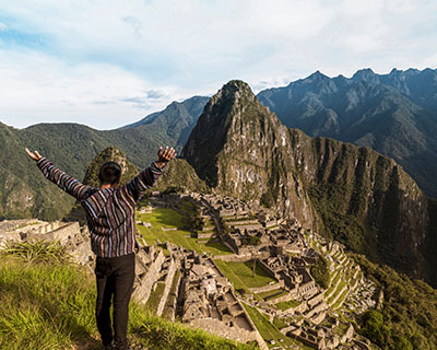 Tourists walking on top of the platforms in Machu Picchu