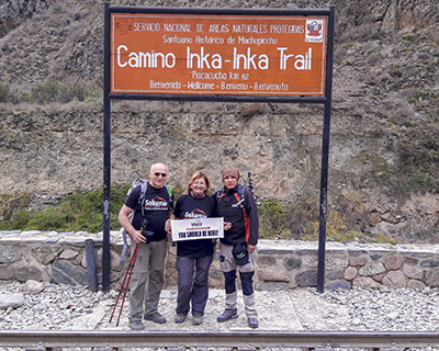 Couple and their guide at km 82 (Piscacucho) ready to start the 4-day Inca trail