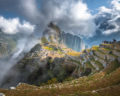 Mystical Machu Picchu amidst clouds and sun rays