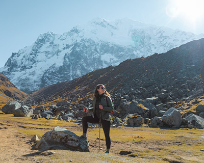 Woman is resting in Suyrococha, one hour from the Abra de Salkantay