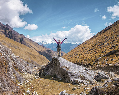 Woman enjoying the view of the Salkantay Valley